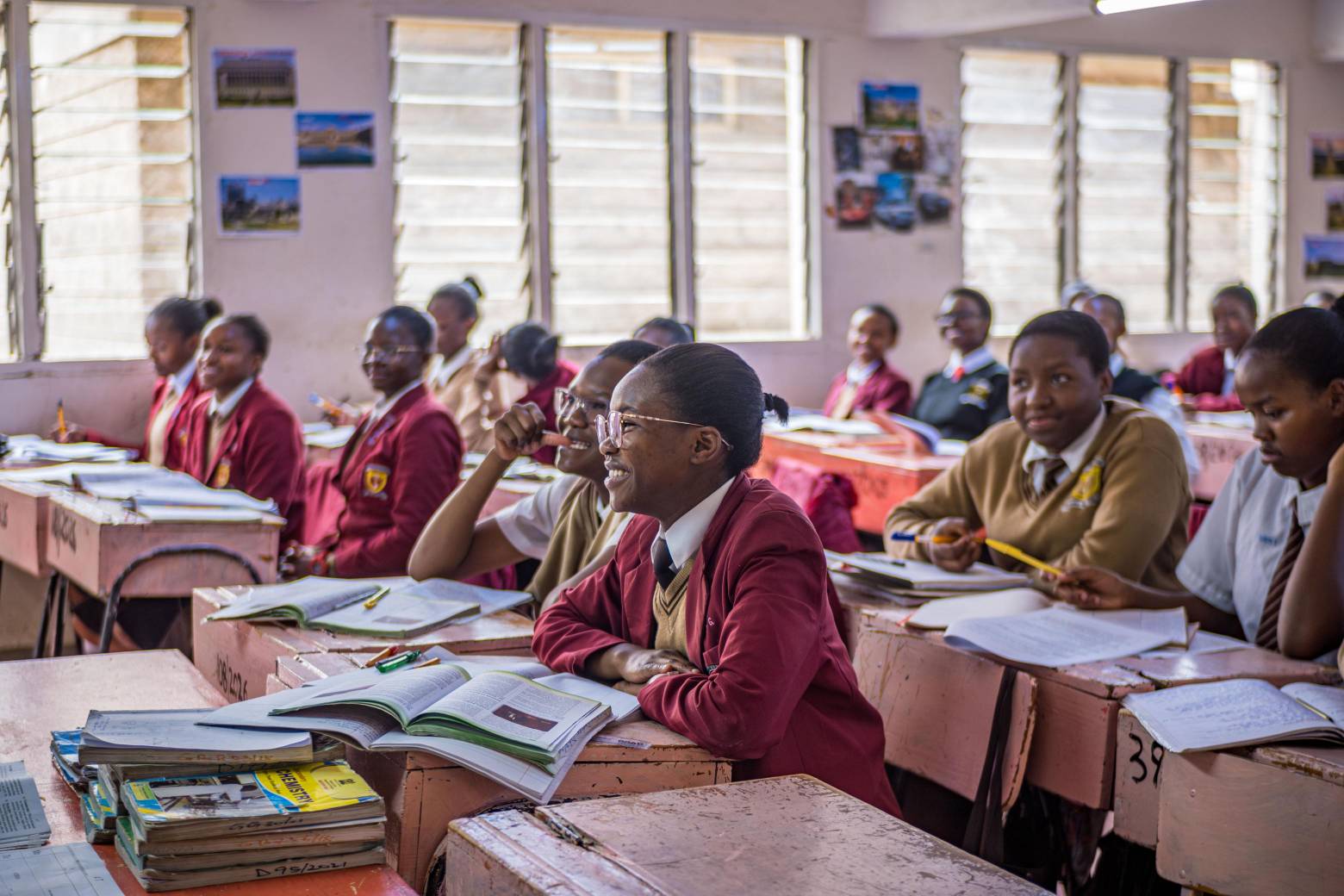 Students focused on their studies in a well-lit classroom